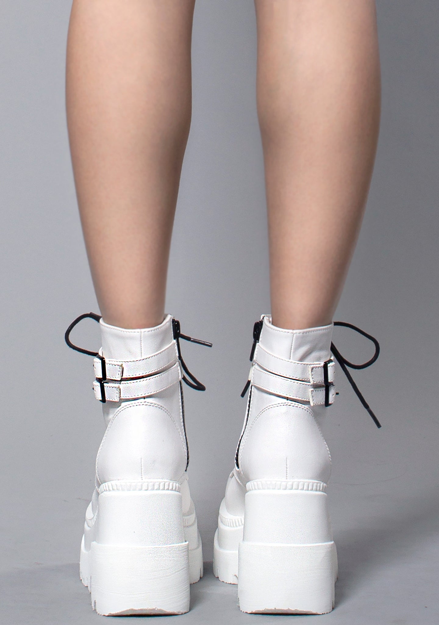 Shop Demonia Shaker Platform Boots in White at LA