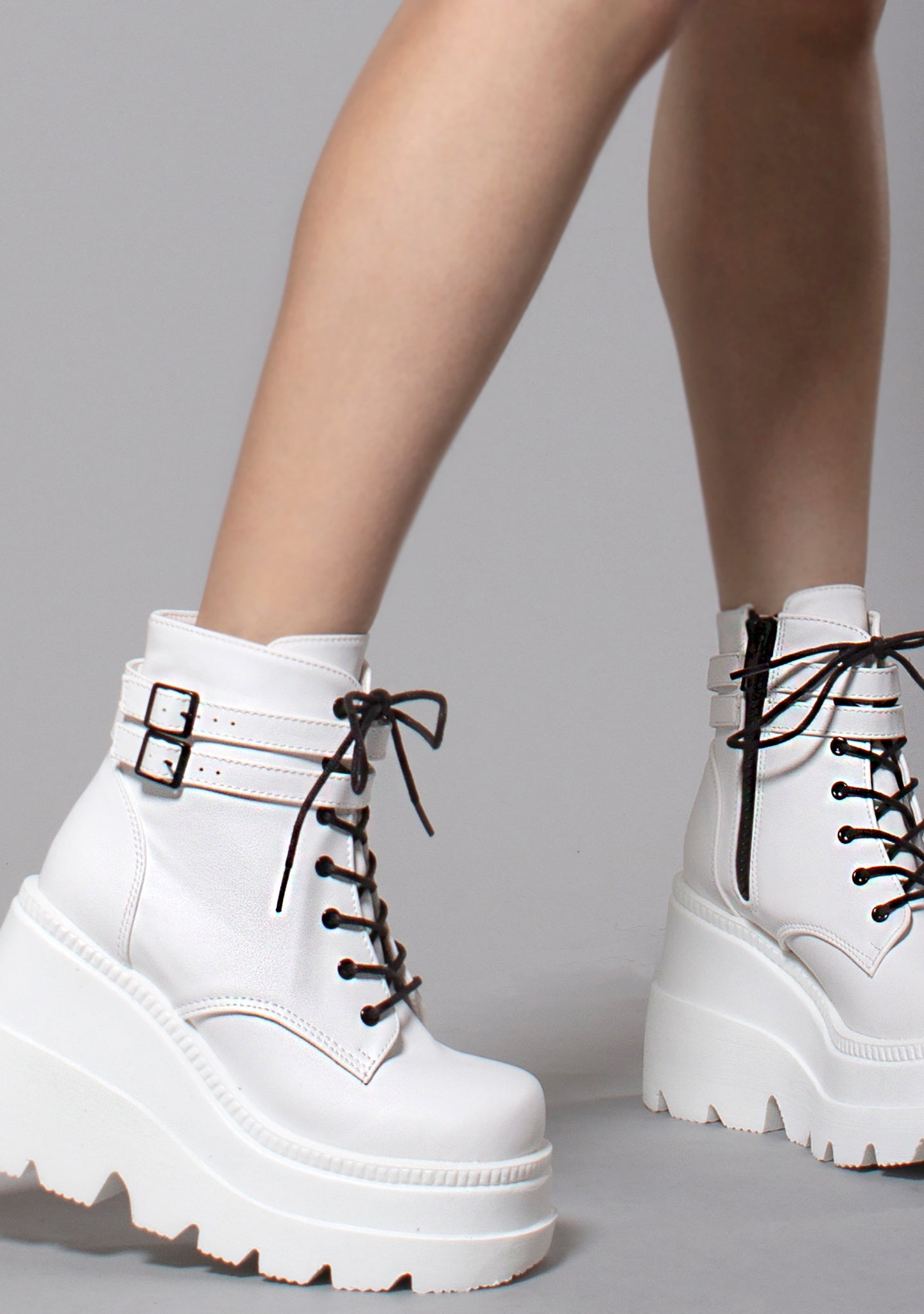 Shop Demonia Shaker Platform Boots in White at LA